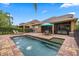 Inviting backyard featuring a brick-lined pool and spa, perfect for outdoor relaxation and entertaining at 11607 Meridian Point Dr, Tampa, FL 33626