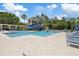 Features a large swimming pool with a water slide and plenty of lounge chairs at 11607 Meridian Point Dr, Tampa, FL 33626