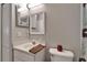 Bright bathroom featuring neutral walls, a white vanity, and a shower with an opaque glass door at 11626 Pure Pebble Dr, Riverview, FL 33569