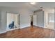 Bright bedroom features hardwood floors and sliding glass door to lanai at 11626 Pure Pebble Dr, Riverview, FL 33569
