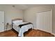 Cozy bedroom with wood floors and a double door closet for ample storage at 11626 Pure Pebble Dr, Riverview, FL 33569