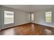 Flexible bonus room featuring wood flooring and lots of natural light at 11626 Pure Pebble Dr, Riverview, FL 33569