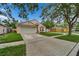 Charming single-Gathering home with a well-manicured lawn, driveway, and attached garage at 11626 Pure Pebble Dr, Riverview, FL 33569
