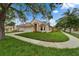 Attractive single-Gathering home on a well-kept lawn, showcasing its architectural design and landscaping at 11626 Pure Pebble Dr, Riverview, FL 33569