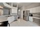 Kitchen with stainless appliances, white cabinets, and adjacent breakfast nook at 11626 Pure Pebble Dr, Riverview, FL 33569