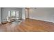 Spacious living room with wood floors and comfortable seating, ideal for gatherings and relaxation at 11626 Pure Pebble Dr, Riverview, FL 33569