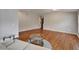 Spacious living room with hardwood floors, modern furniture, and neutral paint at 11626 Pure Pebble Dr, Riverview, FL 33569