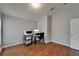 Functional office space with wood flooring and ample room for productivity at 11626 Pure Pebble Dr, Riverview, FL 33569
