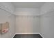 Spacious walk-in closet with ample shelving for storage at 11626 Pure Pebble Dr, Riverview, FL 33569