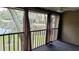 Screened in balcony with an idyllic water view and ceiling fan at 12041 Environmental Dr # 6, New Port Richey, FL 34654