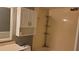 Bathroom featuring a shower and tub combo, storage shelving, and a vanity at 12041 Environmental Dr # 6, New Port Richey, FL 34654