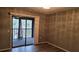Relaxing bedroom featuring a sliding glass door to a screened in balcony at 12041 Environmental Dr # 6, New Port Richey, FL 34654
