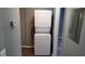 Laundry area featuring a stacked washer and dryer for convenience at 12041 Environmental Dr # 6, New Port Richey, FL 34654