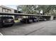 Community parking featuring covered carports for residents and guests at 12041 Environmental Dr # 6, New Port Richey, FL 34654