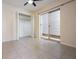Bright bedroom with tile flooring, closet, and sliding glass door to a patio at 12233 Armenia Gables Cir # 12233, Tampa, FL 33612