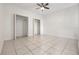 Spacious bedroom with tile flooring and double closets for ample storage at 12233 Armenia Gables Cir # 12233, Tampa, FL 33612