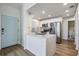 Modern kitchen features stainless appliances, an island, and white cabinetry at 12233 Armenia Gables Cir # 12233, Tampa, FL 33612