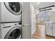 Convenient laundry area near the kitchen with stacked washer and dryer at 12233 Armenia Gables Cir # 12233, Tampa, FL 33612