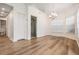 Bright and airy living room with modern floors, chandelier, and neutral walls at 12233 Armenia Gables Cir # 12233, Tampa, FL 33612