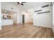 Open-concept living space flows into kitchen, highlighted by modern floors and bright, neutral walls at 12233 Armenia Gables Cir # 12233, Tampa, FL 33612