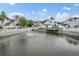 Scenic view of the community pond with fountain, community buildings, and waterfront at 12233 Armenia Gables Cir # 12233, Tampa, FL 33612