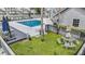 Pool area with patio seating and picnic table amid well-maintained grounds at 12233 Armenia Gables Cir # 12233, Tampa, FL 33612