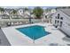 Community pool with lounge chairs surrounded by lush landscaping at 12233 Armenia Gables Cir # 12233, Tampa, FL 33612
