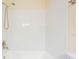 Clean white tile shower with modern shower head fixture and trim at 12233 Armenia Gables Cir # 12233, Tampa, FL 33612