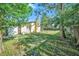 Spacious backyard showing the exterior of the house with a chimney at 1349 Foxboro Dr, Brandon, FL 33511