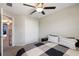 Bright bedroom featuring carpet, ceiling fan, bed with pillows, and closet in neutral tones at 14323 Easy Goer St, Ruskin, FL 33573