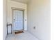 Welcoming entryway with a neutral color palette and a decorative table at 14323 Easy Goer St, Ruskin, FL 33573