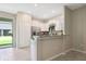 Modern kitchen with white cabinets, stainless steel appliances, and granite countertops at 14323 Easy Goer St, Ruskin, FL 33573