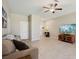 Comfortable living room with tile floors, stylish decor, and an open floor plan at 14323 Easy Goer St, Ruskin, FL 33573