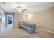Upstairs living area with carpet and a ceiling fan at 14323 Easy Goer St, Ruskin, FL 33573