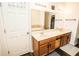 Bathroom vanity featuring double sinks, wood cabinets, large mirrors and vanity lighting at 1510 Rushgrove Cir, Dover, FL 33527
