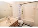 Bright bathroom with a shower-tub combo and stylish mermaid-themed shower curtain at 1510 Rushgrove Cir, Dover, FL 33527