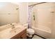 Bright bathroom with a shower-tub combo and stylish mermaid-themed shower curtain at 1510 Rushgrove Cir, Dover, FL 33527