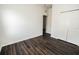 A bright bedroom with dark floors and a closet provides ample space at 1510 Rushgrove Cir, Dover, FL 33527
