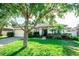 Charming single-story home featuring a well-maintained lawn and a two-car garage at 1510 Rushgrove Cir, Dover, FL 33527