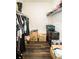 Walk-in closet with wire shelving filled with boxes and hanging clothes at 1510 Rushgrove Cir, Dover, FL 33527