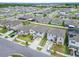 Aerial neighborhood view showcasing the home's location, landscaping, and nearby houses at 16685 Parker River St, Wimauma, FL 33598