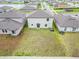 Spacious backyard featuring a well-maintained lawn, perfect for outdoor activities and relaxation at 16685 Parker River St, Wimauma, FL 33598