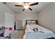 Bright, comfortable bedroom featuring fan, double bed, closet, and storage drawer at 16685 Parker River St, Wimauma, FL 33598