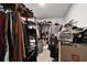 Organized walk-in closet featuring ample storage for clothing and accessories at 16685 Parker River St, Wimauma, FL 33598