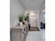 Bright foyer with a decorative cabinet, hall tree and a view of the entryway at 16685 Parker River St, Wimauma, FL 33598