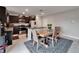 Kitchen featuring dark cabinetry, stainless steel appliances, and eat-in dining space at 16685 Parker River St, Wimauma, FL 33598