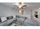 Spacious living area includes a sectional sofa and plenty of room for entertaining at 16685 Parker River St, Wimauma, FL 33598