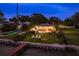 Aerial view showcases a property with waterfront access, a pool, a dock, and outdoor living at 1748 Sunset Dr, Clearwater, FL 33755