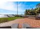 Backyard with hot tub, grassy area, and water views at 1748 Sunset Dr, Clearwater, FL 33755