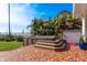 Backyard hot tub with a view of the water and surrounding landscaping at 1748 Sunset Dr, Clearwater, FL 33755